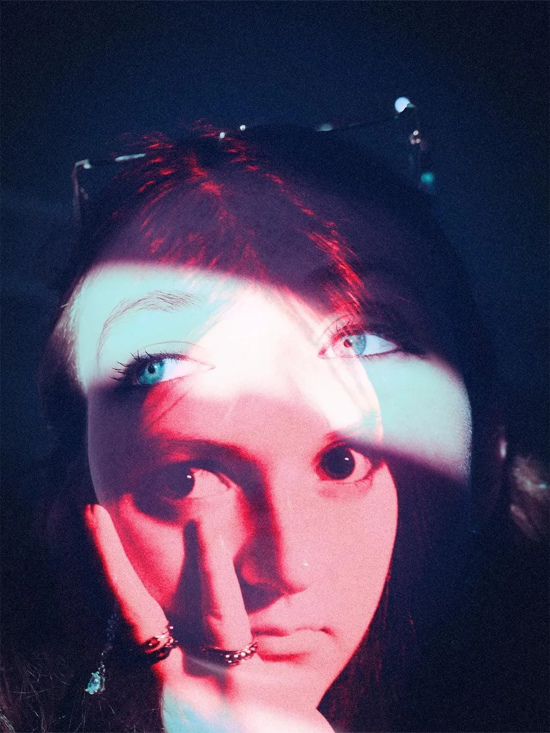 Editorial portrait framed by a beam of light with a double-exposure effect