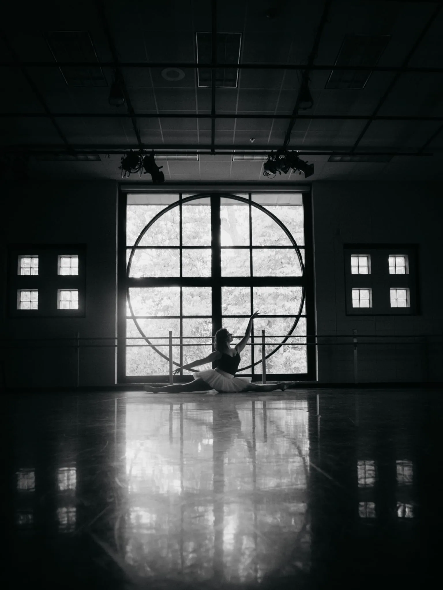 Ballet dancer posed in a studio in black and white