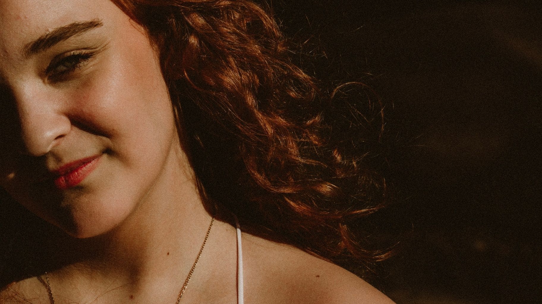 Red-haired portrait in warm side light