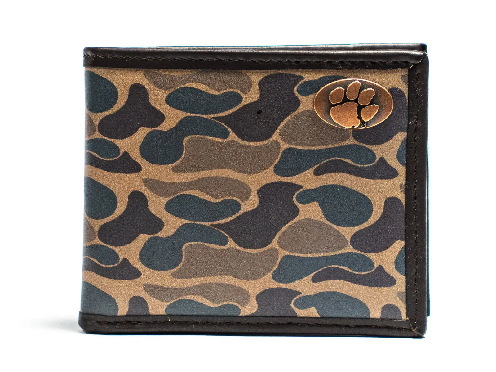 Dimensional retail wallet photographed to reveal its metal emblem and edge construction