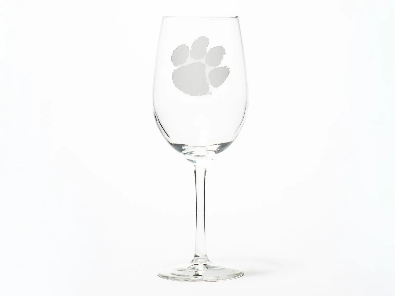 Etched stemless glass photographed with its transparent material kept crisp and dimensional